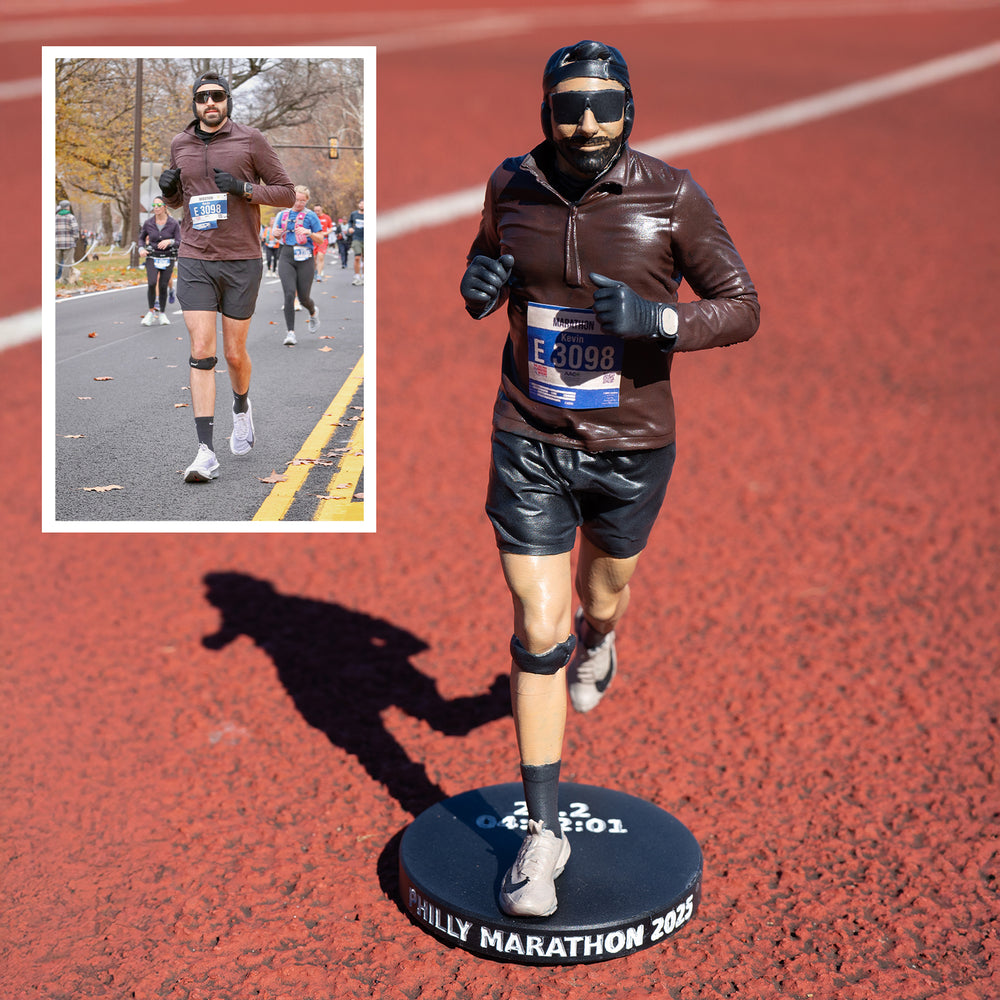 Painted Premium custom figure of a marathon runner in a brown top and knee sleeve on an engraved black base