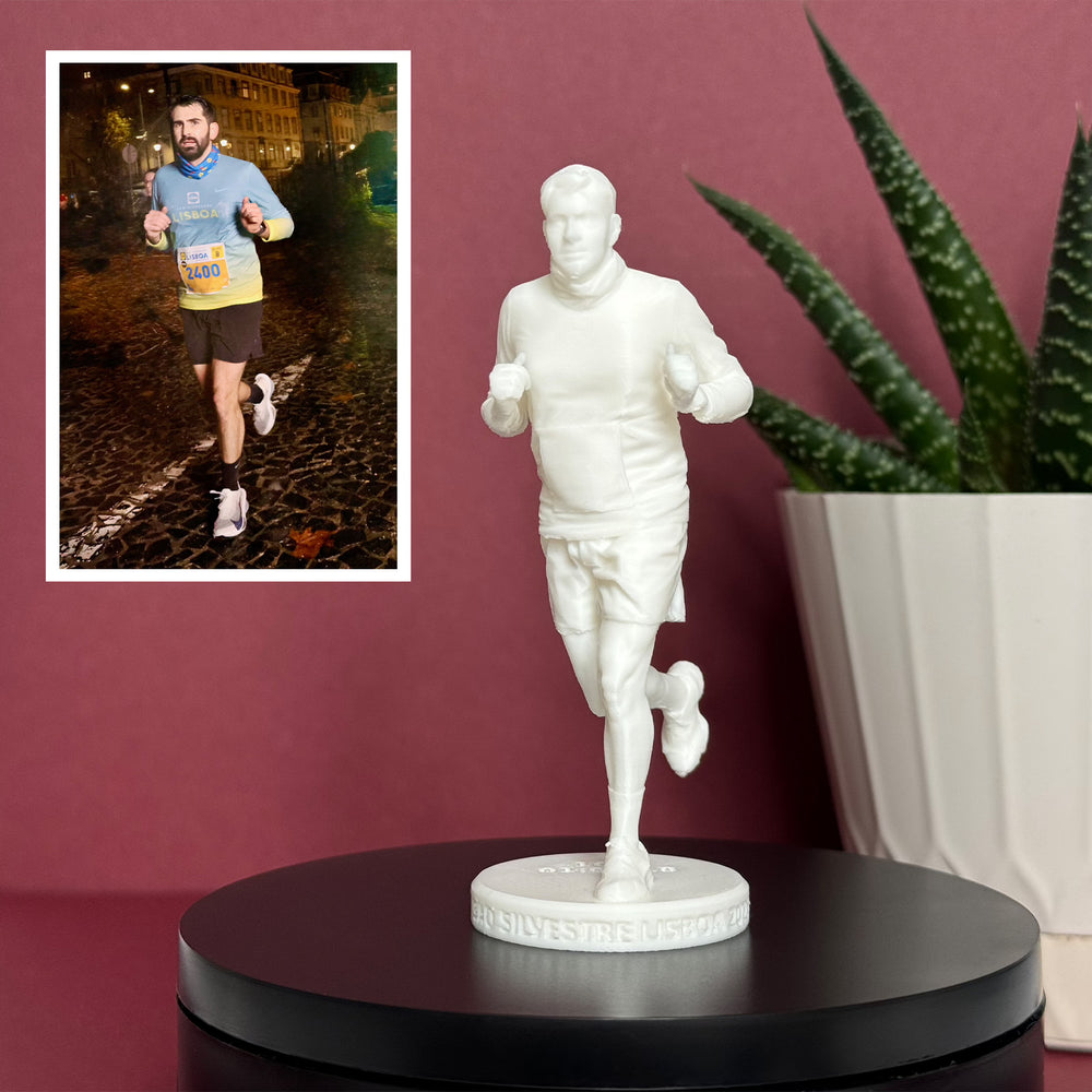 Unpainted Mini custom figure of a runner on an engraved white base, with the original night race photo